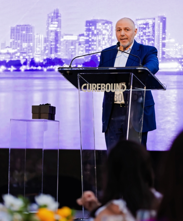 Dr. Ezra Cohen gives a speech.